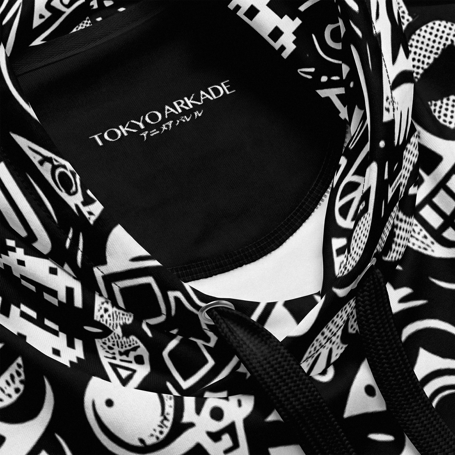 Black and white patterned bag with 'TOKYO ARKADE' branding.
