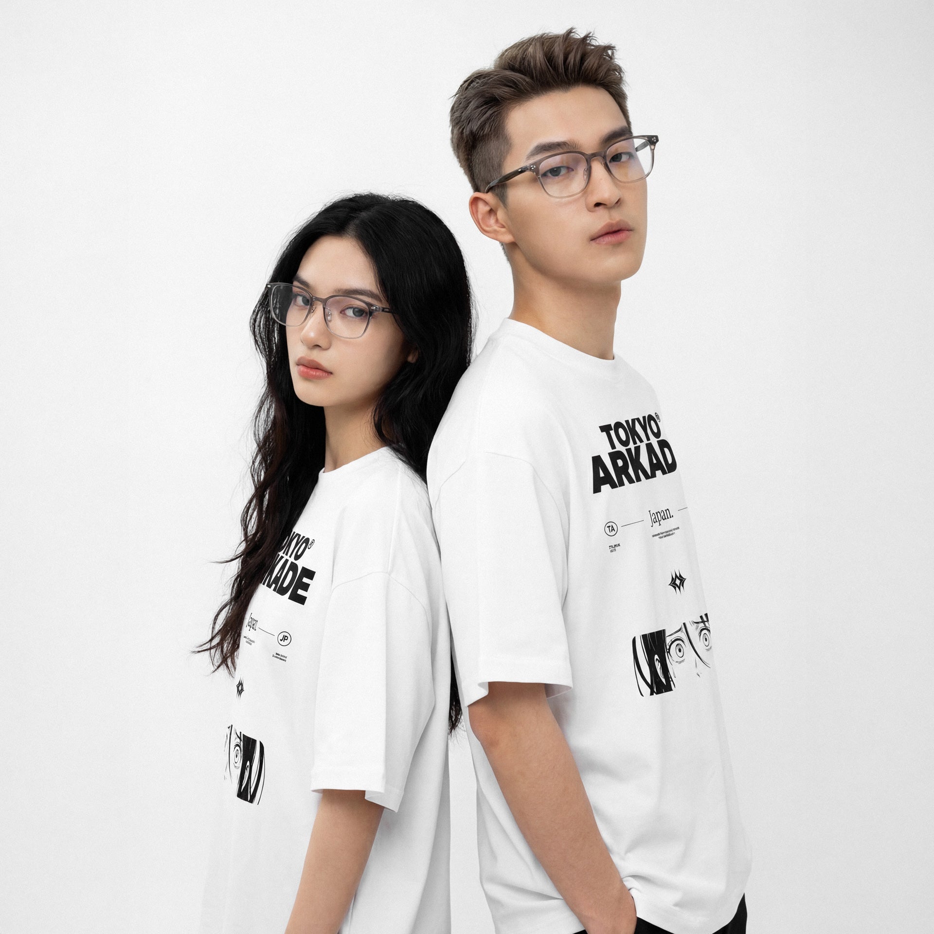 Two people wearing white t-shirts with black text and graphics on a white background anime manga